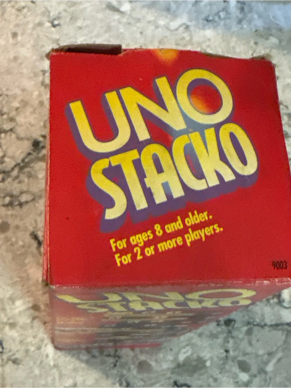 Mattel UNO Stacko Red Game Box with Yellow and Blue Elements